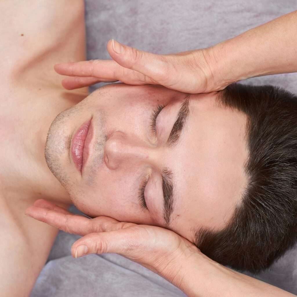 Facial massage, young handsome man