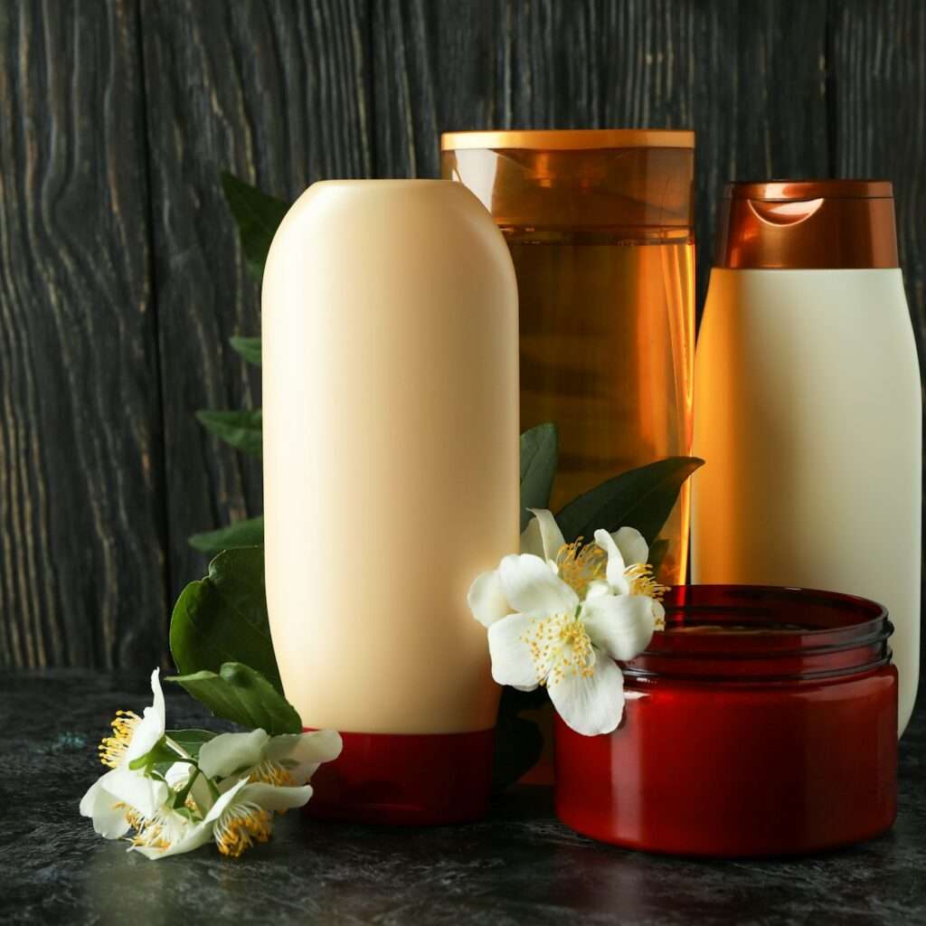 Hair care accessories against rustic wooden background