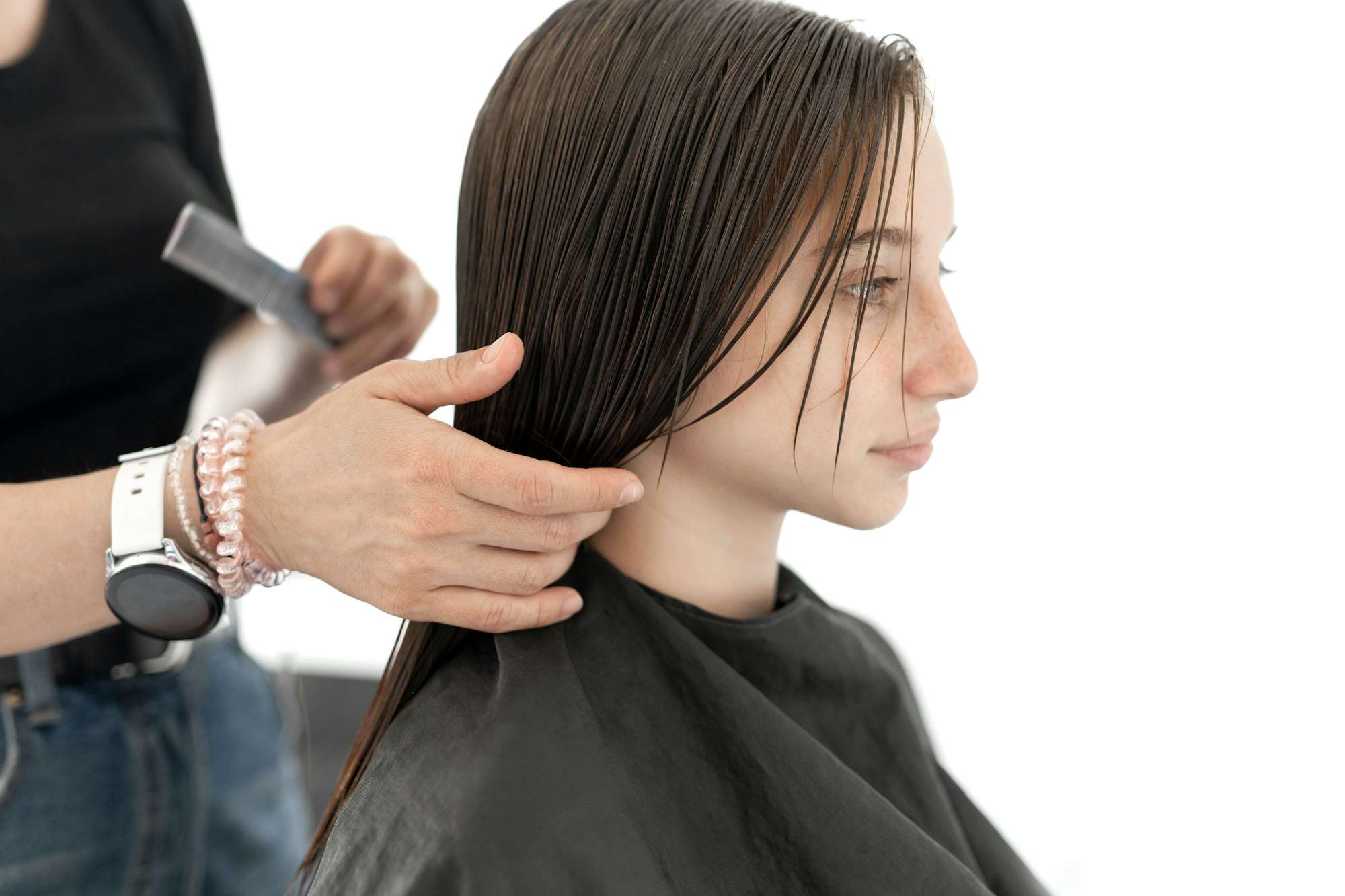 Preteen girl during haircut